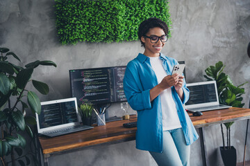 Photo of pretty young girl hold device coding wear blue shirt coworking programmer successful nice...