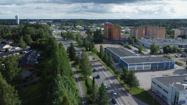 Low flyover of picturesque streets of Kerava in vast Finland forest