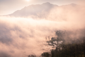 Fototapeta premium Sunrise over YuanYang rice terraces in Yunnan, China
