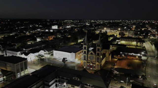 Drone does 360 around Saint-Peter-and-Paul Basilica of Paramaribo at night in Paramaribo, Suriname