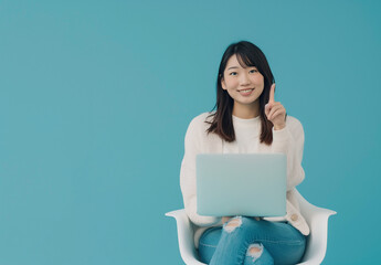Naklejka premium A woman holding a notebook sitting on a chair