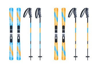 Pairs of blue and orange mountain skis and ski poles standing upright