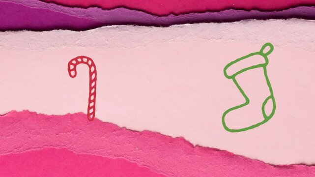Animation of hand drawing candy cane and sock over paper cards