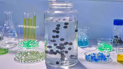 The photo of experiment concept from frontal shot, in the middle of lab table displaying a large...