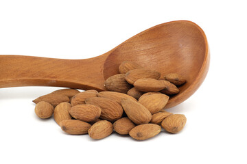 Wooden spoon with almonds isolated on white background