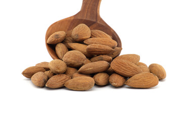 Wooden spoon with almonds isolated on white background