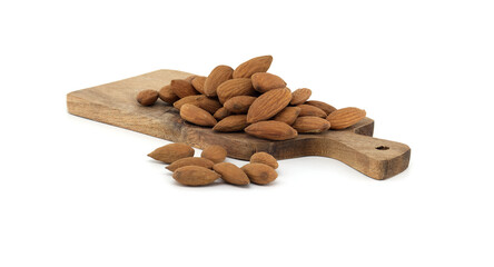 Healthy raw almonds on wooden cutting board isolated on white background