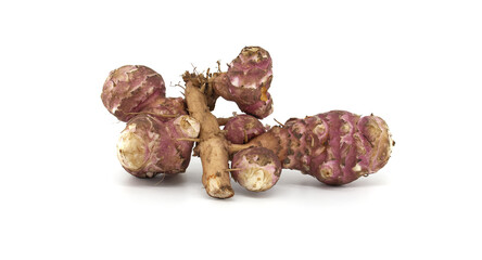 Fresh raw Jerusalem artichokes isolated against a white background