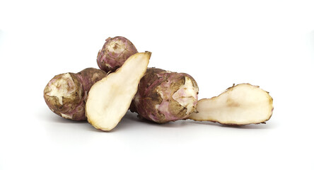 Fresh raw Jerusalem artichokes isolated against a white background
