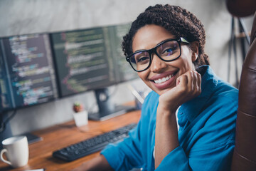 Photo of pretty young girl dreamy charming software engineer developer wear blue shirt coworking...