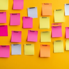 Colorful sticky notes arranged on a yellow background for brainstorming ideas.