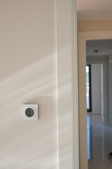  Smart Thermostat on White Wall for Optimal Home Temperature Control
