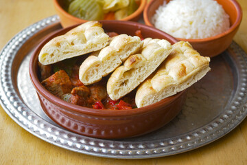 Enjoy a Traditional Dish with Bread, Rice, and flavorful Pickles that tantalize taste buds
