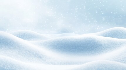 A snowy hillside with a blue sky in the background. The snow is white and fluffy, creating a peaceful and serene atmosphere