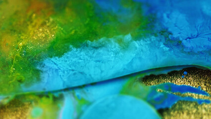 Fluid paint landscape. Fantasy acrylic art. Blur blue green yellow color wet glitter ink swirl water stream gold foil texture abstract background.