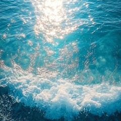 A tranquil turquoise sea with rippling waves and delicate foam sparkling under the golden rays of the sun