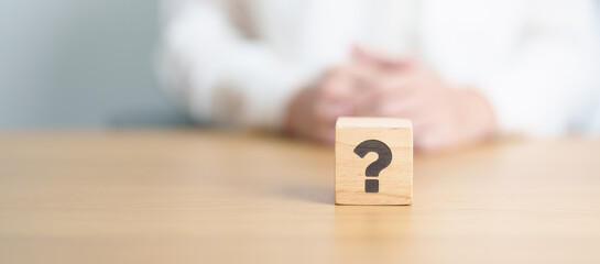 Wood block of Questions Mark ( ? ) sign. FAQ, frequency asked questions, Answer, Q and A,...
