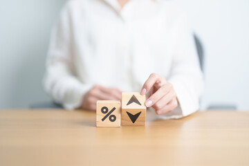wood block of percentage change to UP and Down arrow. Interest rate, GDP, stocks market, financial,...