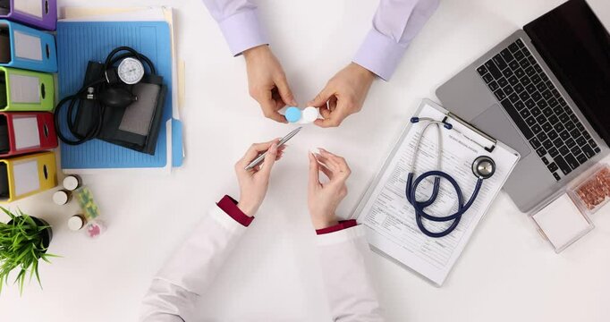 Doctor and patient discuss soft contact lenses for eyes