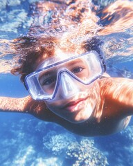 Fototapeta premium Joyful Latino Boy Snorkeling Amidst Vibrant Coral Reef in Clear Blue Waters