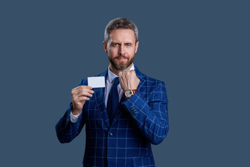 Success of business. Businessman in suit hold credit card isolated on grey. Business branding. Pay the bill. Businessman with credit card. Business deal with emoney. Exchange business cards