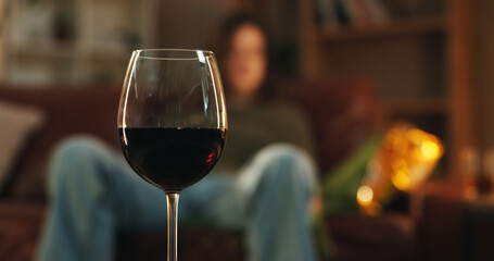 House, glass and wine for alcohol addition at night in living room as stress relief or depression....