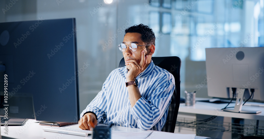 Poster Man, computer and reading at night in office for project review, decision and thinking at media company. Person, writer or editor by pc with problem solving, ideas and feedback at creative agency