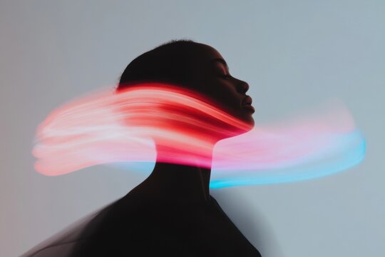 Young woman experiencing sensory overload with light trails