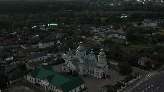 An Aerial View of a Charming Village Featuring a Stunning and Historic Church in the Landscape. Dobrush town, Belarus