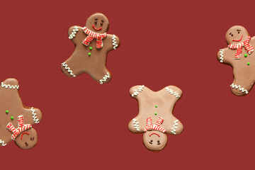 Sweet gingerbread cookies on red background.