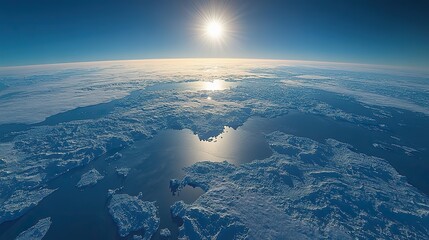 A physical map of the North Pole, Arctic Ocean, and Greenland offers a high-resolution satellite view with the sun shining on the horizon.