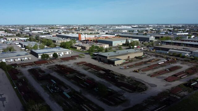 Drone shot of the open-air warehouse with rusty pipes in Calgary.