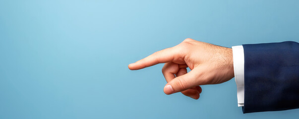 A hand pointing towards a blue background, suggesting direction or emphasis, often used in communication or visual representations.