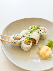 Chop sticks picking up sushi