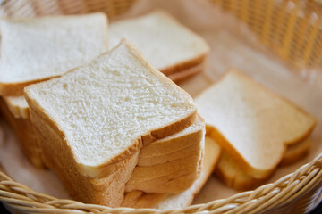 Slices whole wheat bread in wicker basket