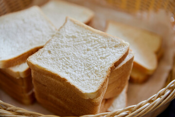 Slices whole wheat bread in wicker basket