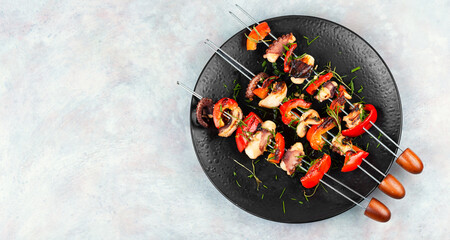 Octopus skewers grilled. © nikolaydonetsk