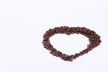 Heart Shape Made of Coffee Beans on White Background
