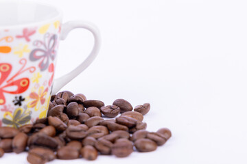 Warm Coffee Delight with Coffee Beans Arranged on a Clean White Surface