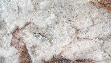 Gray stone texture, hard, rough and cracked surface showing brown stone texture inside, stone background, abstract background.