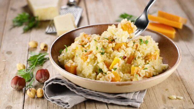footage of fork holding risotto
