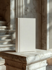 A blank book displayed on a marble surface with classical columns in the background, creating an elegant, timeless look.  
