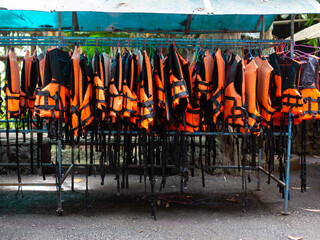 Several life jacket racks for boating.