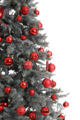 Beautiful Christmas tree decorated with red balls on white background, closeup