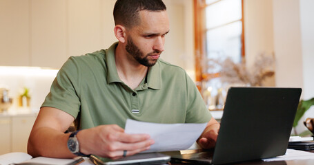 Fototapeta premium Home, man and reading with document on laptop for tax, invoice and bank statement with financial problems. Male person, house and serious with paperwork for inflation, loan and interest rate