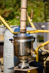 They are heating a samovar outside