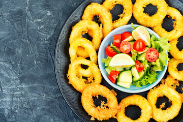 Battered squid rings on plate.