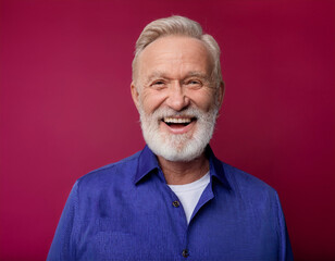 Fototapeta premium Headshot Portrait of a Smiling Mature Man with Contemporary Style, Isolated on Color Background with Ample Copy Space