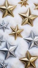 Obraz premium Shimmering silver and gold stars with snow background for invitation or card screensaver