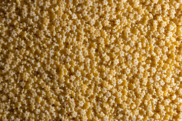 Uncooked Stelline Pasta: A Culinary Canvas of Stelline Macaroni, Creating a Lively and Textured Background for Gourmet Cooking. Dry Pasta. Raw Macaroni - Top View, Flat Lay